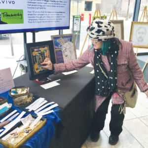 Artist Collective Member Shining Starr gives a talk at the Avivo ArtWorks show at Orchestra Hall